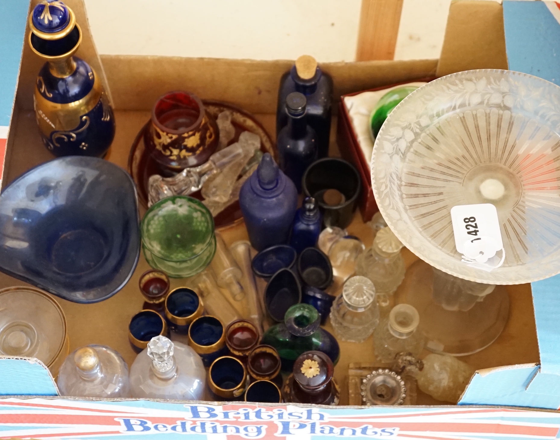 A collection of clear and coloured glassware